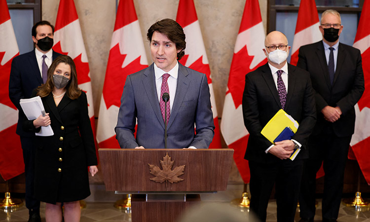 Justin Trudeau with his team of ministers takes part in a news conference on Parliament Hill in Ottawa, Ontario, Canada. Reuters