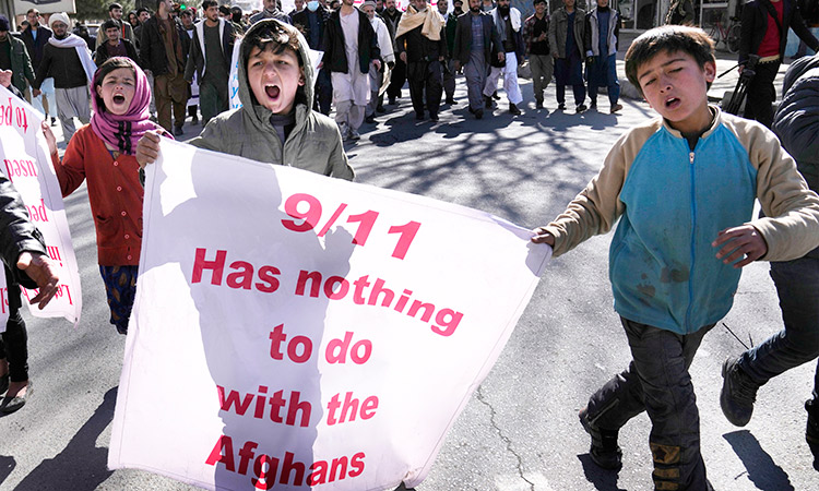 Protesters hold banners as they shout anti-US slogans during a protest condemning President Joe Biden’s decision on frozen Afghan assets in Kabul, Afghanistan.   File/Associated Press