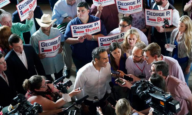 George P. Bush talks with the media at a kick-off rally where he announced he will run for Texas Attorney General, in Austin, Texas. AP