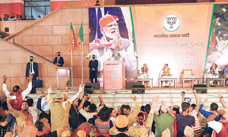 Narendra Modi (centre) addresses party supporters at the BJP headquarters in New Delhi on Thursday. AFP