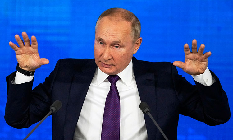 Vladimir Putin gestures during a meeting in Moscow.
