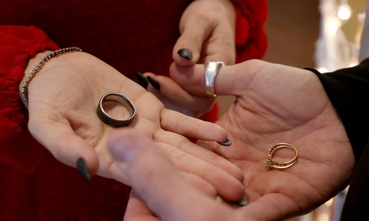 Dan Venezzio and his wife Maura hold their wedding rings as they renew their vows at the Absecon Lighthouse during its annual Wedding Vow Renewal for Valentine’s Day. Tribune News Service