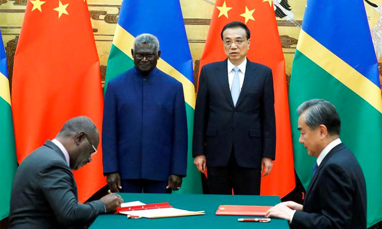 (L-R) Solomon Islands Prime Minister Manasseh Sogavare, Solomon Islands Foreign Minister Jeremiah Manele, Chinese Premier Li Keqiang and Chinese State Councillor and Foreign Minister Wang Yi attend a signing ceremony at the Great Hall of the People in Beijing, China. File/Reuters