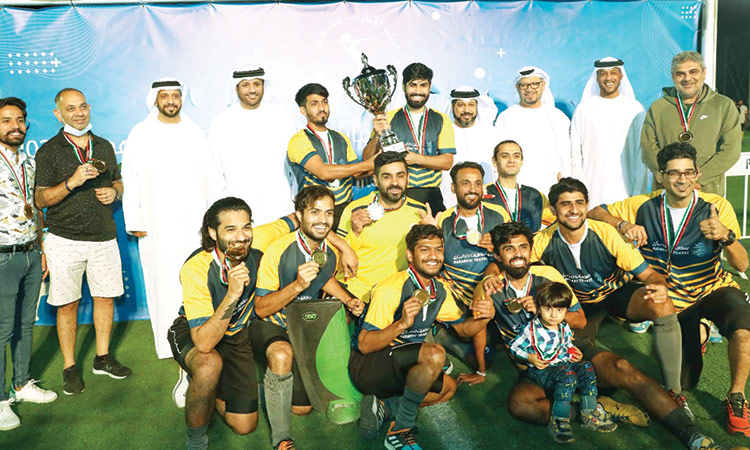 Members of the Dadabhai Travel team, winners of the tournament, with the dignitaries during the presentation ceremony.