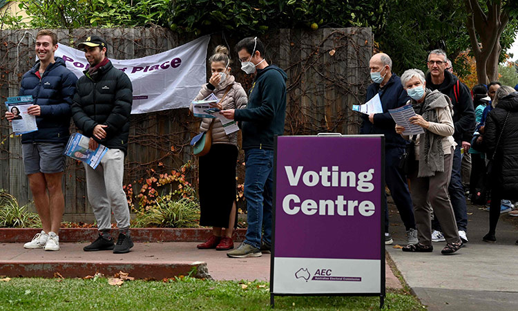 Voters queue at a pre-polling centre in Melbourne on Tuesday, as independent candidate Monique Ryan takes on Australia’s treasurer Josh Frydenberg in the May 21 general election. AFP