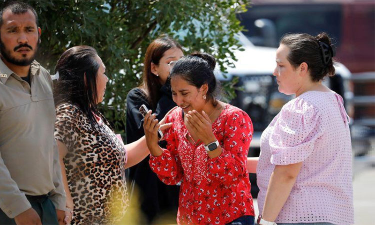 A woman reacts outside the Ssgt Willie de Leon Civic Center, where students had been transported from Robb Elementary School after a shooting, in Uvalde, Texas. Reuters