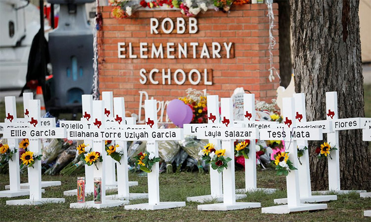 Crosses with the names of victims of a school shooting, are pictured at a memorial outside Robb Elementary school, after a gunman killed nineteen children and two teachers, in Uvalde, Texas