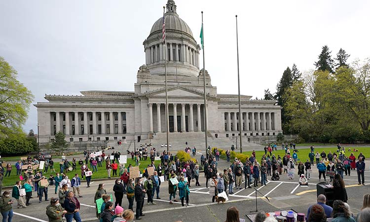 People demonstrate in favour of abortion rights gather during a rally on Tuesday at the Capitol in Olympia, Washington. AP