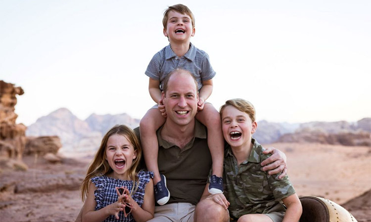 A photo of the Duke of Cambridge grinning with his children on a family holiday in Jordan has been released to celebrate Father's Day.
