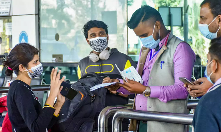 Passengers go through special COVID-19 protocols at the Delhi International Airport.
