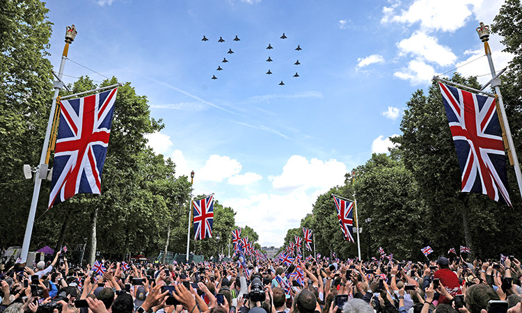 People gathered in The Mall watch a fly-past by the British Royal Air Force’s Eurofighter Typhoon jets forming the number ‘70’ during the celebration of Britain’s Queen Elizabeth’s Platinum Jubilee, in London.  Reuters
