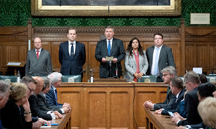 Sir Graham Brady (centre), announces that Boris Johnson has survived an attempt by Tory MPs to oust him as party leader following a confidence at the Houses of Parliament, in London. AP