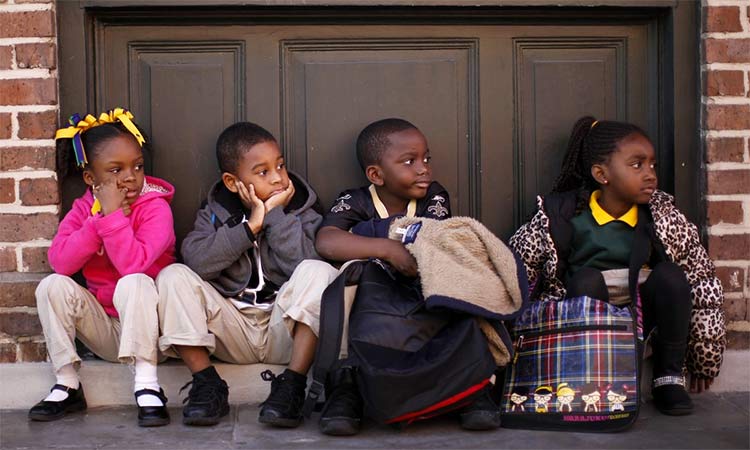 Children waiting for their school bus.