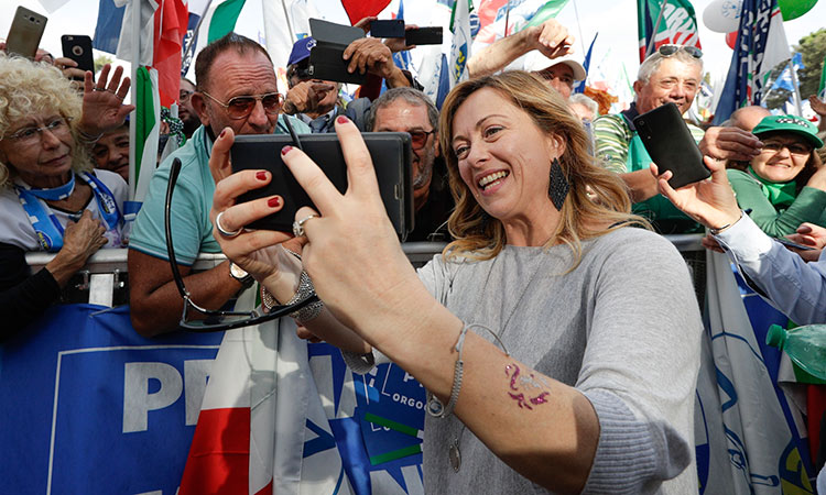  Giorgia Meloni, takes a selfie with supporters during a rally in Rome. AP