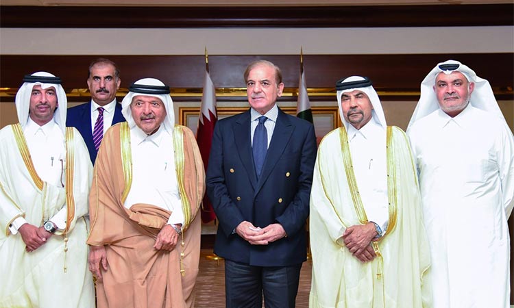 Shahbaz Sharif is photographed with Qatari businessmen who showed their interest in investing in Pakistan. (Image via Twitter)