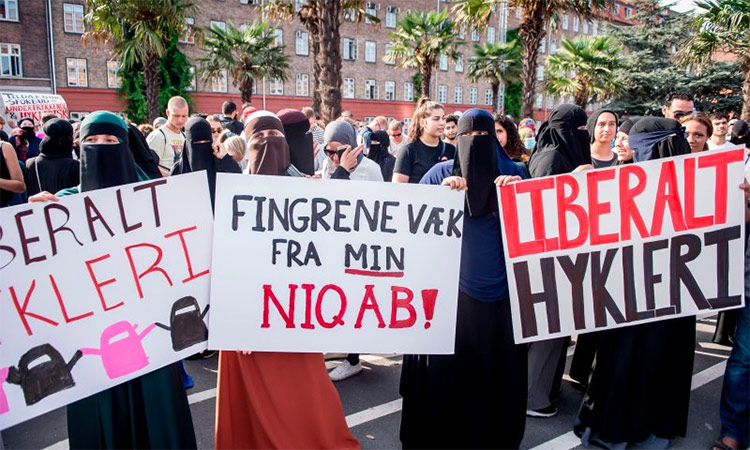Women wearing Niqabs to veil their faces take part in a demonstration in Copenhagen, Denmark. AFP