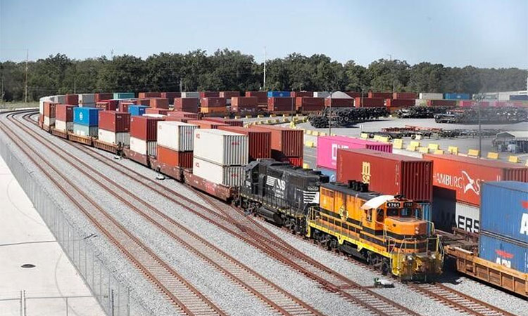 A commercial freight train carries a load of shipping containers at the Port of Savannah, Georgia, US. Reuters