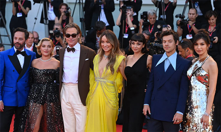 The cast of ‘Don’t Worry Darling’ lines up for photographers at the Venice Film Festival. (Image via Twitter)