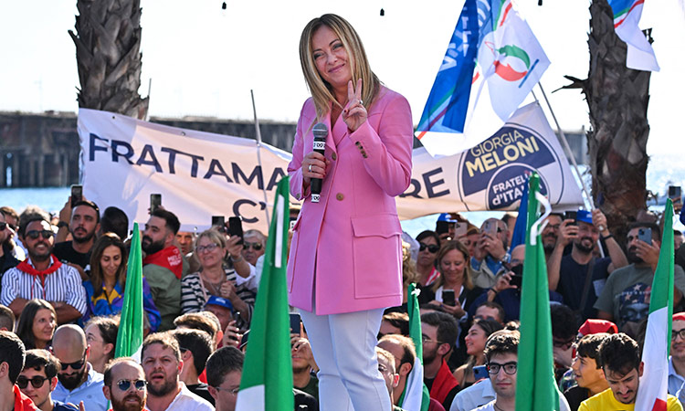 Giorgia Meloni delivers a speech at the Arenile di Bagnoli beachfront location in Naples. AFP