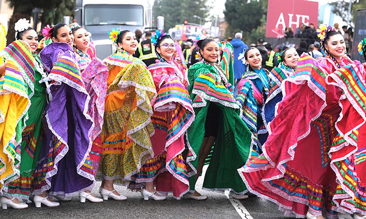 Members of the Cathedral City High School Ballet Folklorico pose for a photo prior to joining in the Kingdom Day Parade in Los Angeles, on Monday.  Associated Press