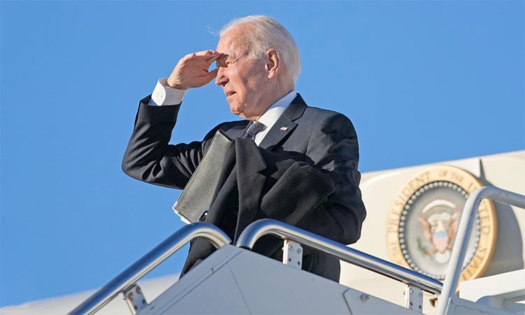 President Joe Biden pauses before boarding Air Force One at Delaware Air National Guard Base in New Castle, Delaware on  Sunday en route to Atlanta. AP