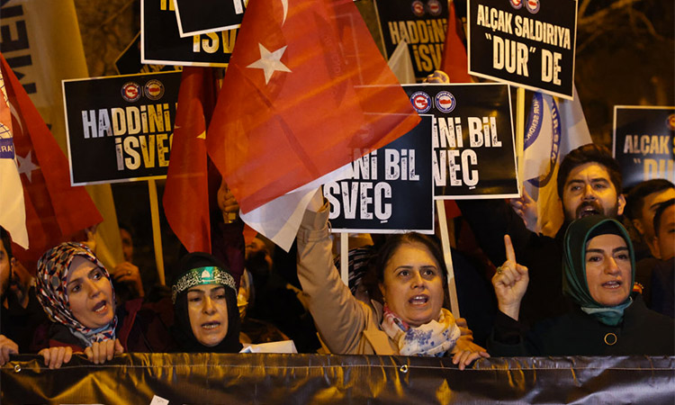 Protesters chant slogans during a demonstration outside the Sweden’s embassy in Ankara. (AFP)