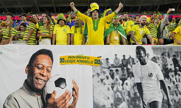 Brazil fans unveil a flag of Pele prior to the FIFA World Cup Qatar 2022 Group G match between Cameroon and Brazil.