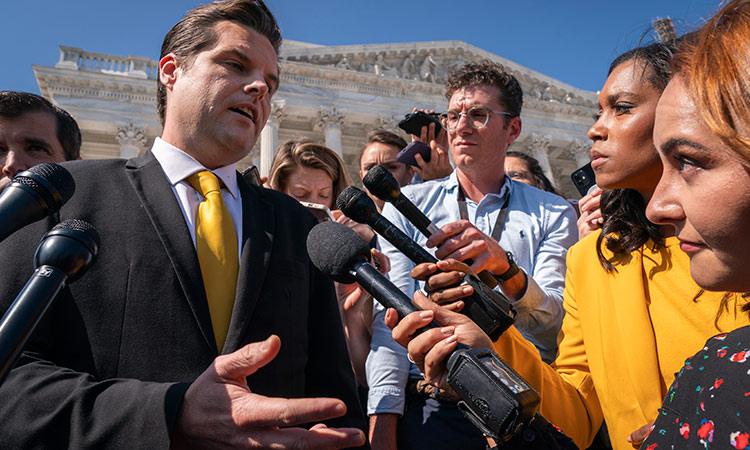 Matt Gaetz (left) answers questions from members of the media after speaking on the House floor, at the Capitol in Washington.  Associated Press
