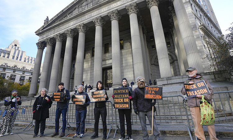 Halloween-themed protesters stand in front of New York Supreme Court, where former President Donald Trump is facing fraud charges, on Oct.31, 2023, in New York. Asosciated Press