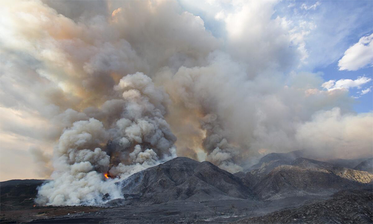 Smoke rises from a wildfire near Yucaipa, California. AP