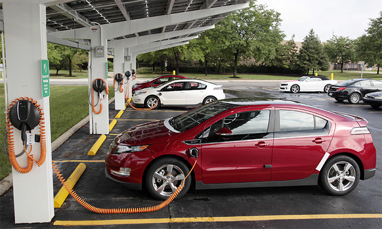 Chevrolet Volt electric vehicles are parked at solar-powered electric charging stations designed by Sunlogics in the parking lot of General Motors Co's assembly plant in Hamtramck, Michigan. US. Reuters