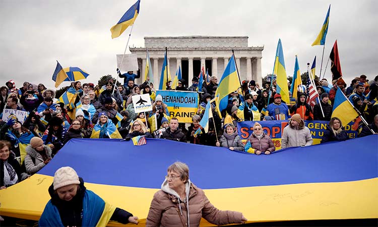 Supporters of Ukraine and members of the Ukrainian community hold a rally to mark the one-year anniversary of Russia’s invasion of Ukraine, near Lincoln Memorial on the National Mall in Washington, DC, on Saturday.  Agence France-Presse