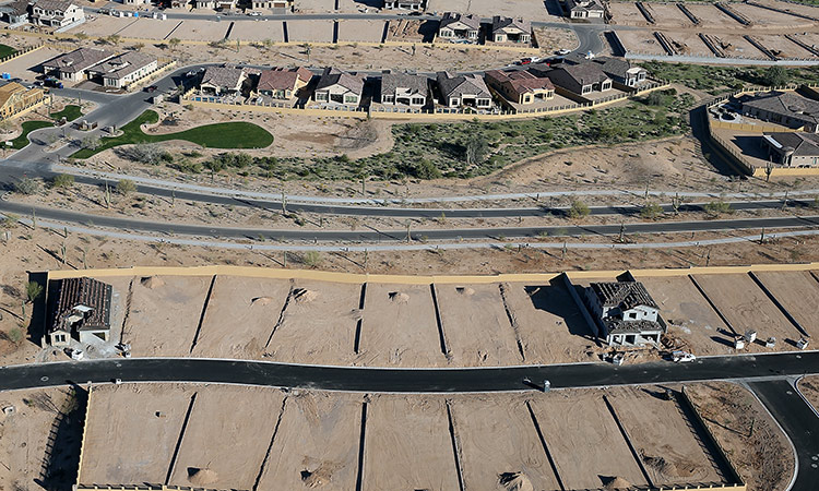 New homes are under construction at a housing development in Mesa, Arizona. Tribune News Service