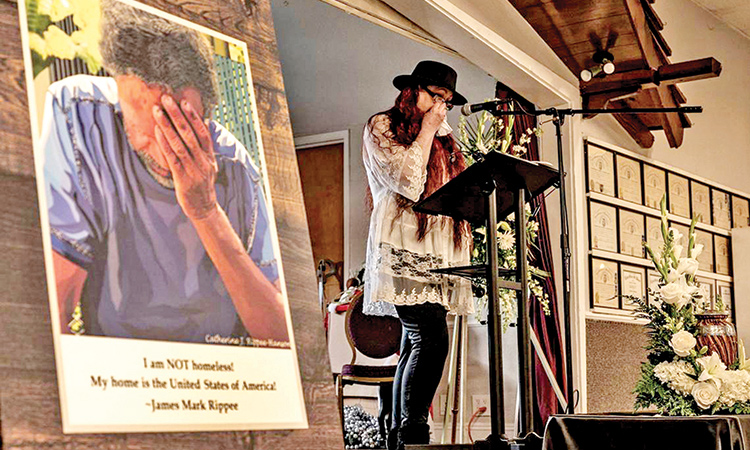 Catherine J. Rippee-Hanson wipes tears while giving an emotional eulogy about her brother James Mark Rippee, pictured at left, during his memorial service in Vacaville.   Tribune News Service