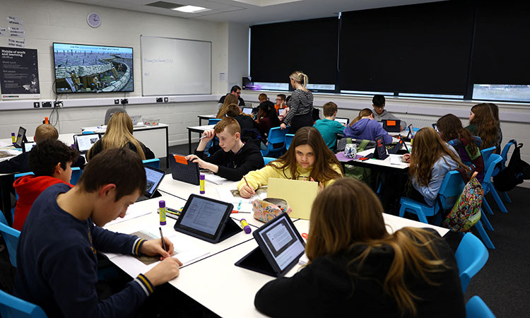 Pupils attend a lesson, at XP East High School, in Doncaster, Britain on Feb.20, 2023. Reuters