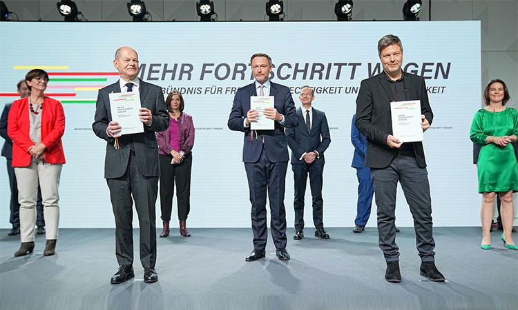 The leaders of the Social Democrats, Greens and the Free Democrats pose with the copies of a three-party coalition deal in Berlin. (File)