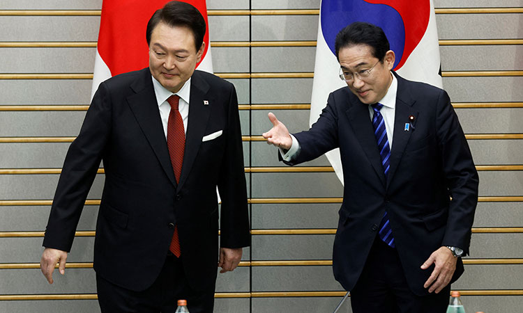 Japan’s Prime Minister Fumio Kishida and South Korea’s President Yoon Suk Yeol attend a meeting at the prime minister’s official residence in Tokyo, Japan on Thursday.  Reuters