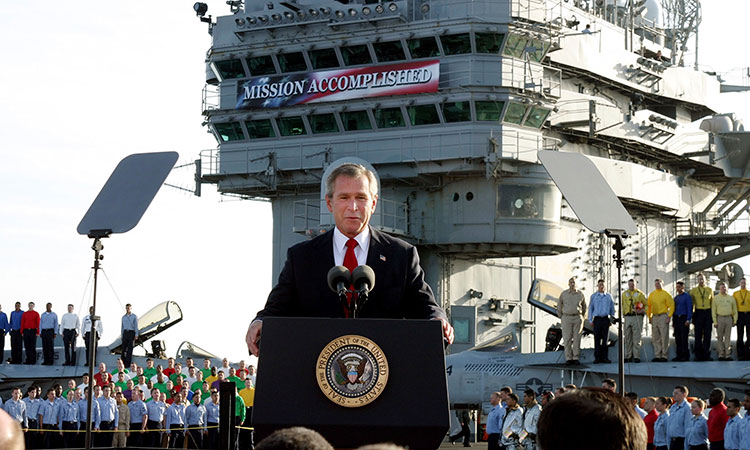 President George W. Bush speaks aboard the aircraft carrier USS Abraham Lincoln off the California coast on May 1, 2003. File/AP