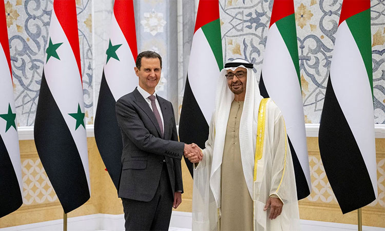 Sheikh Mohamed Bin Zayed Al Nahyan greets Bashar Al Assad at Qasr Al Watan in Abu Dhabi. Reuters