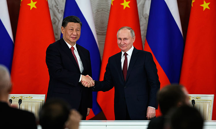 Russian President Vladimir Putin (right) and Chinese President Xi Jinping shake hands after speaking during a signing ceremony following their talks at The Grand Kremlin Palace, in Moscow, Russia, March 21, 2023.  Associated Press