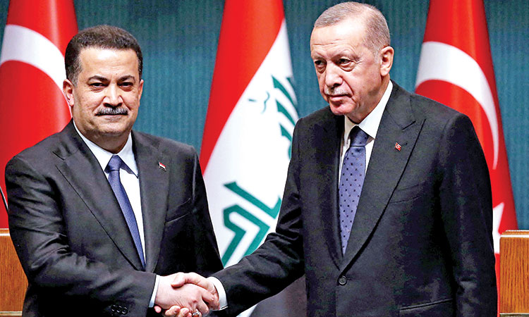 Turkish President Recep Tayyip Erdogan (right) and Iraqi Prime Minister Mohamed Shia al-Sudani shake hands during a joint press conference after their meeting at the Presidential Palace in Ankara on March 21, 2023.  Agence France-Presse