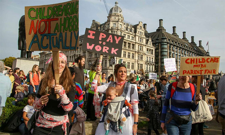 Parents and children at the March of the Mummies protest in London demanding better child-care, parental leave and flexible working policies. AP
