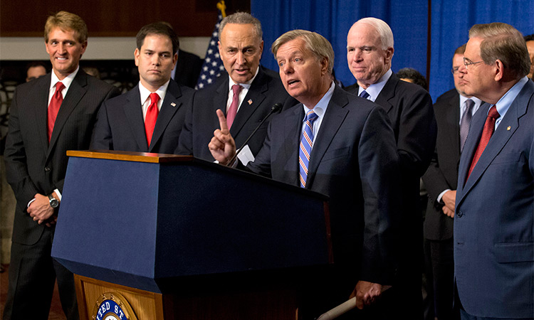 Sen. Lindsey Graham (centre), speaks of immigration reform legislation outlined by the Senate’s bipartisan ‘Gang of Eight’ that would create a path for the nation’s 11 million unauthorised immigrants to apply for US citizenship Capitol Hill in Washington. Associated Press