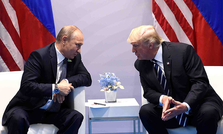 Vladimir Putin in converstaion with Donald Trump.