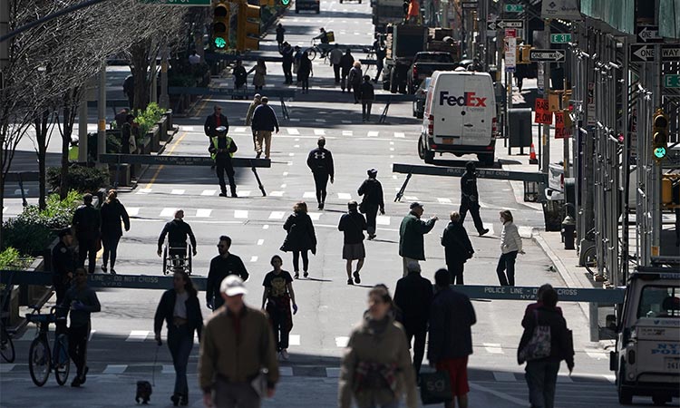 People walk on Park Avenue in the Manhattan borough of New York City, New York. Reuters