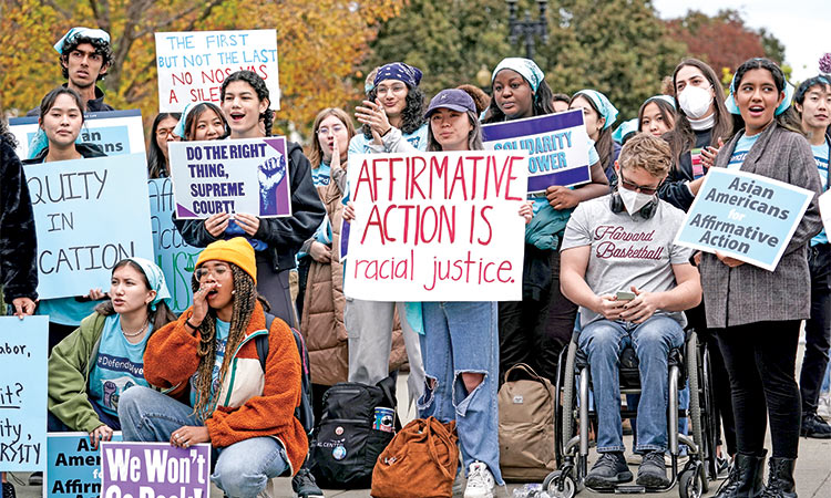 Activists demonstrate as the Supreme Court hears oral arguments on a pair of cases that could decide the future of affirmative action in college admissions, in Washington.   File/Associated Press