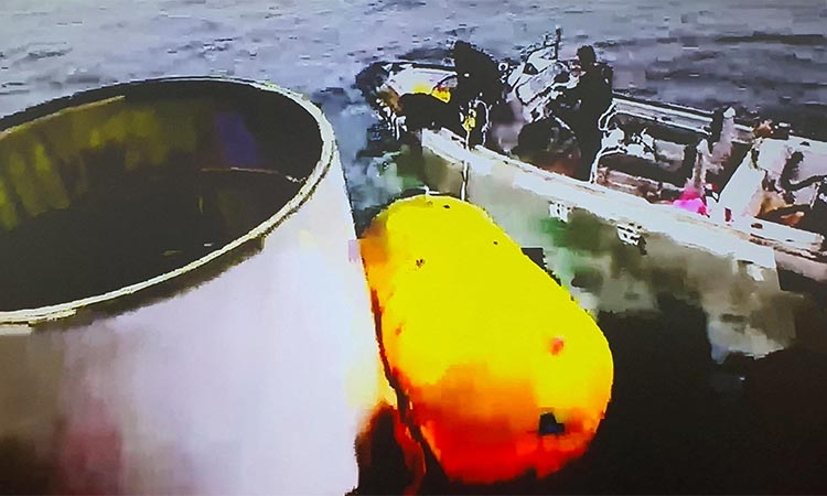 A handout picture shows what is believed to be a part of a space launch vehicle that North Korea said crashed into the sea off the west coast of the divided peninsula, South Korea