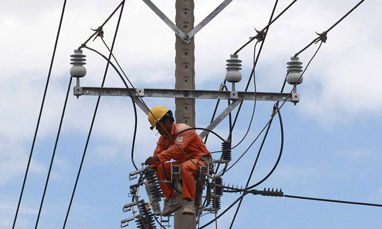 A worker fixes an electricity grid in Vietnam's southern Mekong delta city of Can Tho. Reuters
