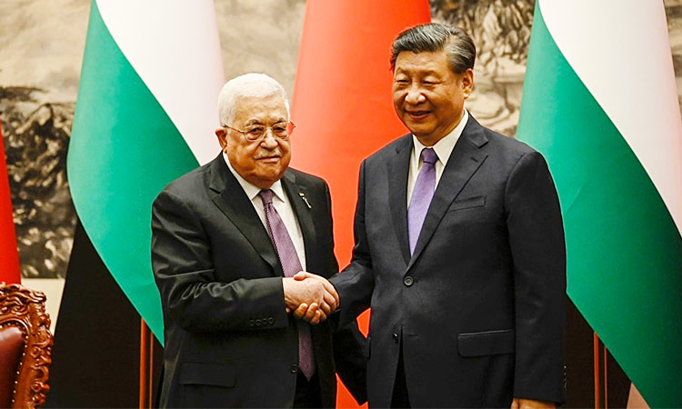 China's President Xi Jinping and Palestinian President Mahmoud Abbas shake hands after a signing ceremony at the Great Hall of the People in Beijing. Reuters
