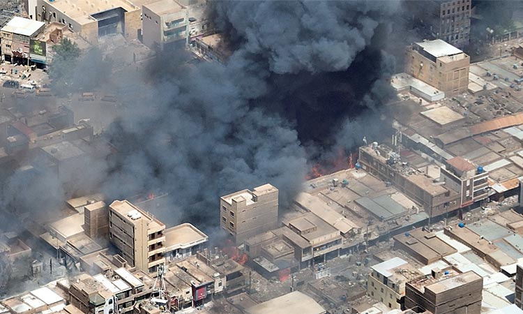 A view shows black smoke and fire at Omdurman market in Omdurman, Sudan. Reuters